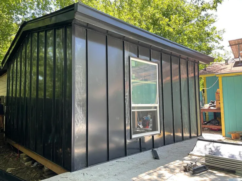 Black standing seam metal wall panels for Metal Roof Installation in Charlottesville