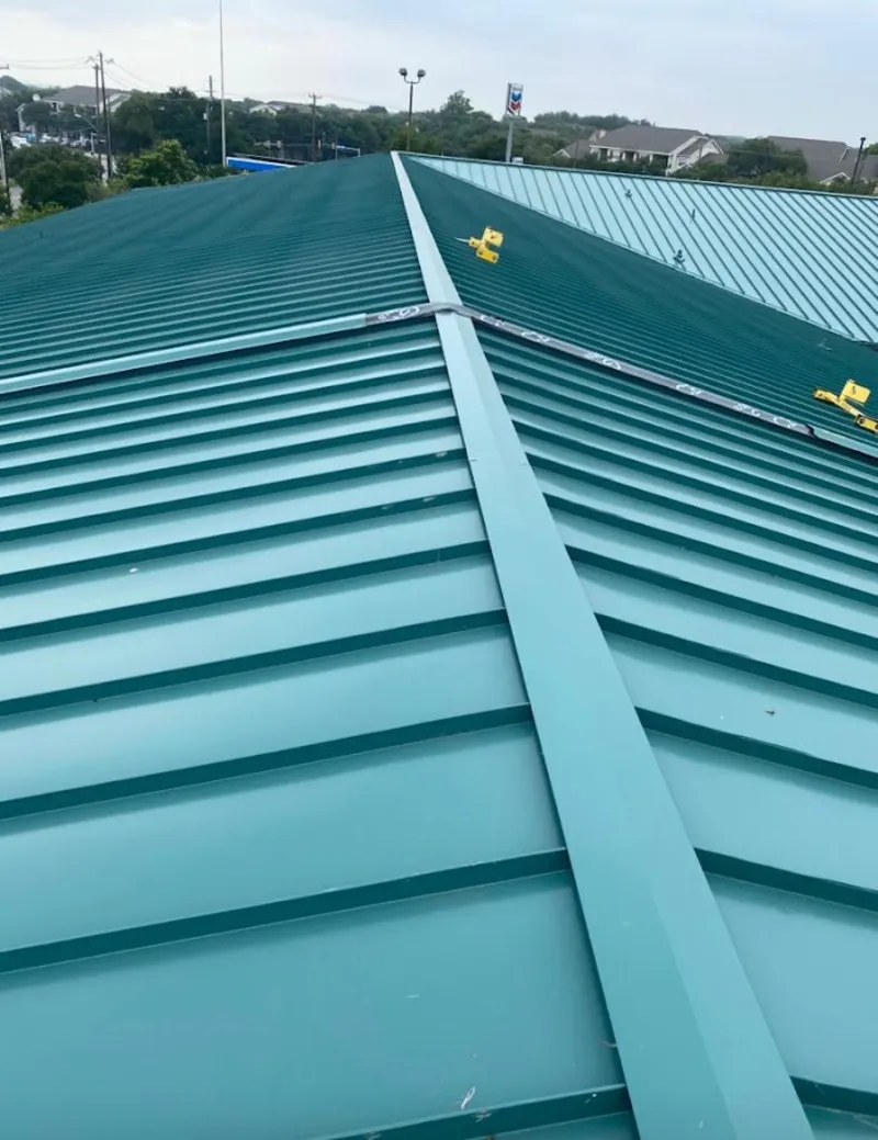 Green commercial metal roof ridge and valley for Metal Roof Repair in Charlottesville