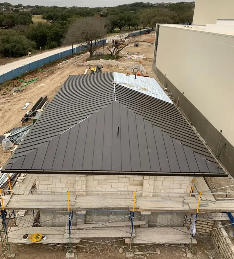 Metal roof new construction with scaffolding in Charlottesville